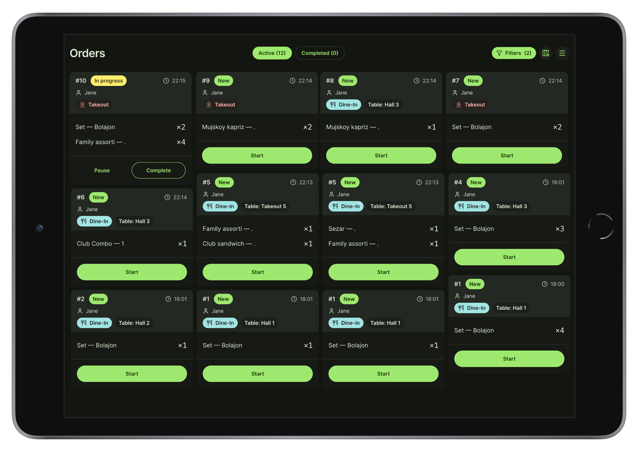 Kitchen display tablet showing synchronized order queues